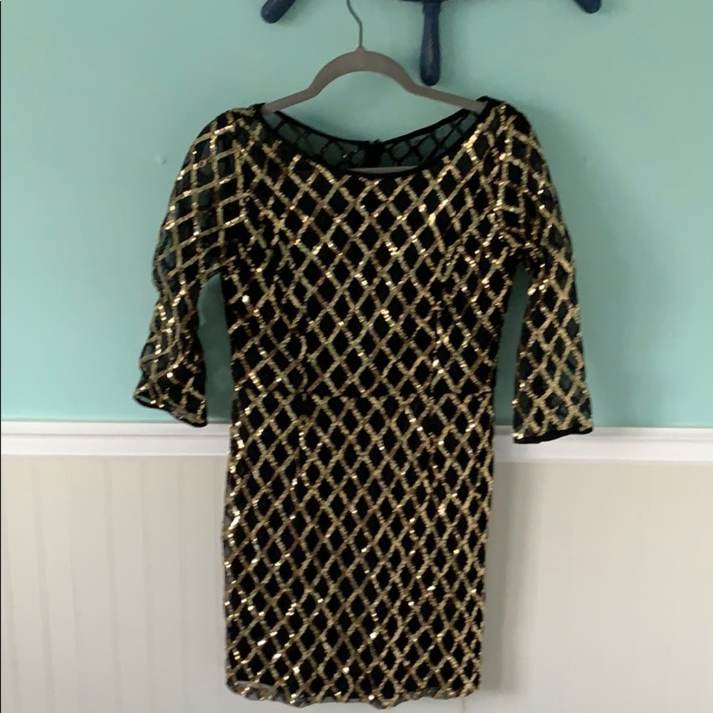 Black and gold sequin dress